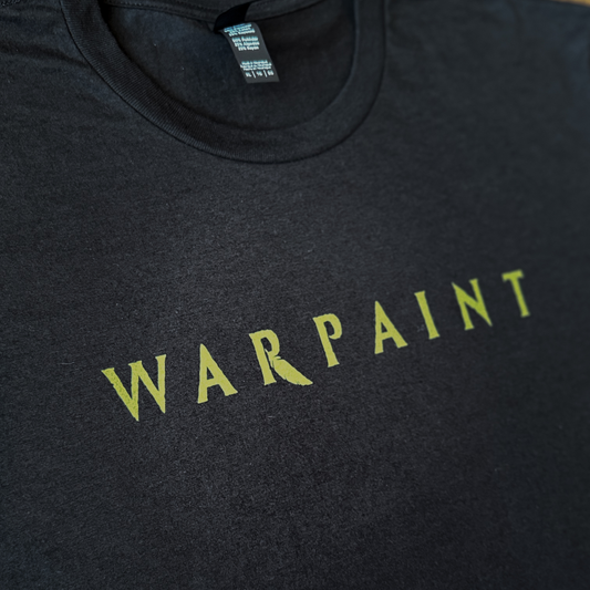 Black t-shirt with 'WARPAINT' printed in yellow on a dark background