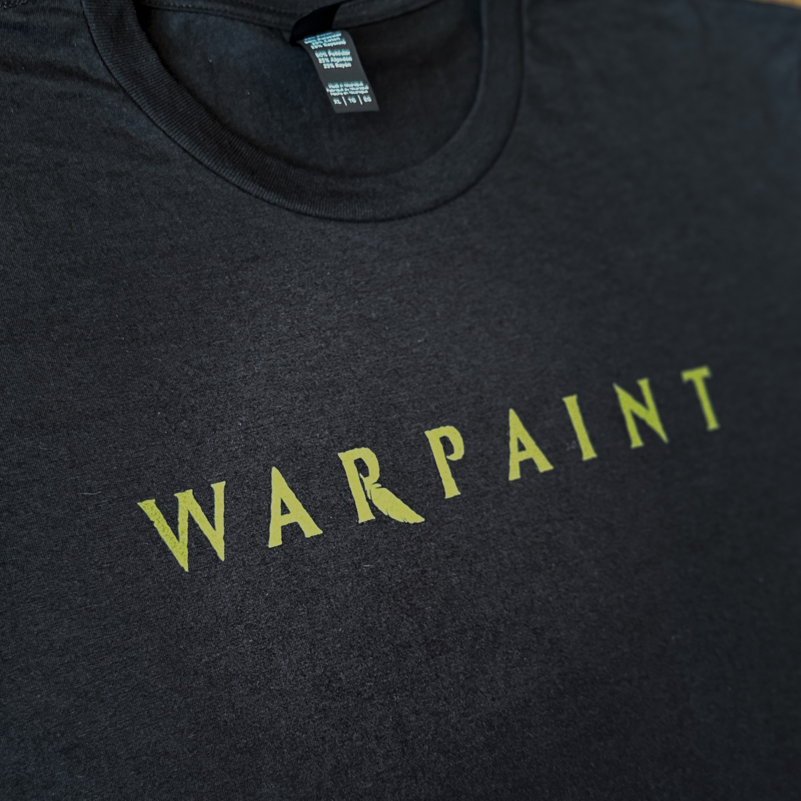 Black t-shirt with 'WARPAINT' printed in yellow on a dark background