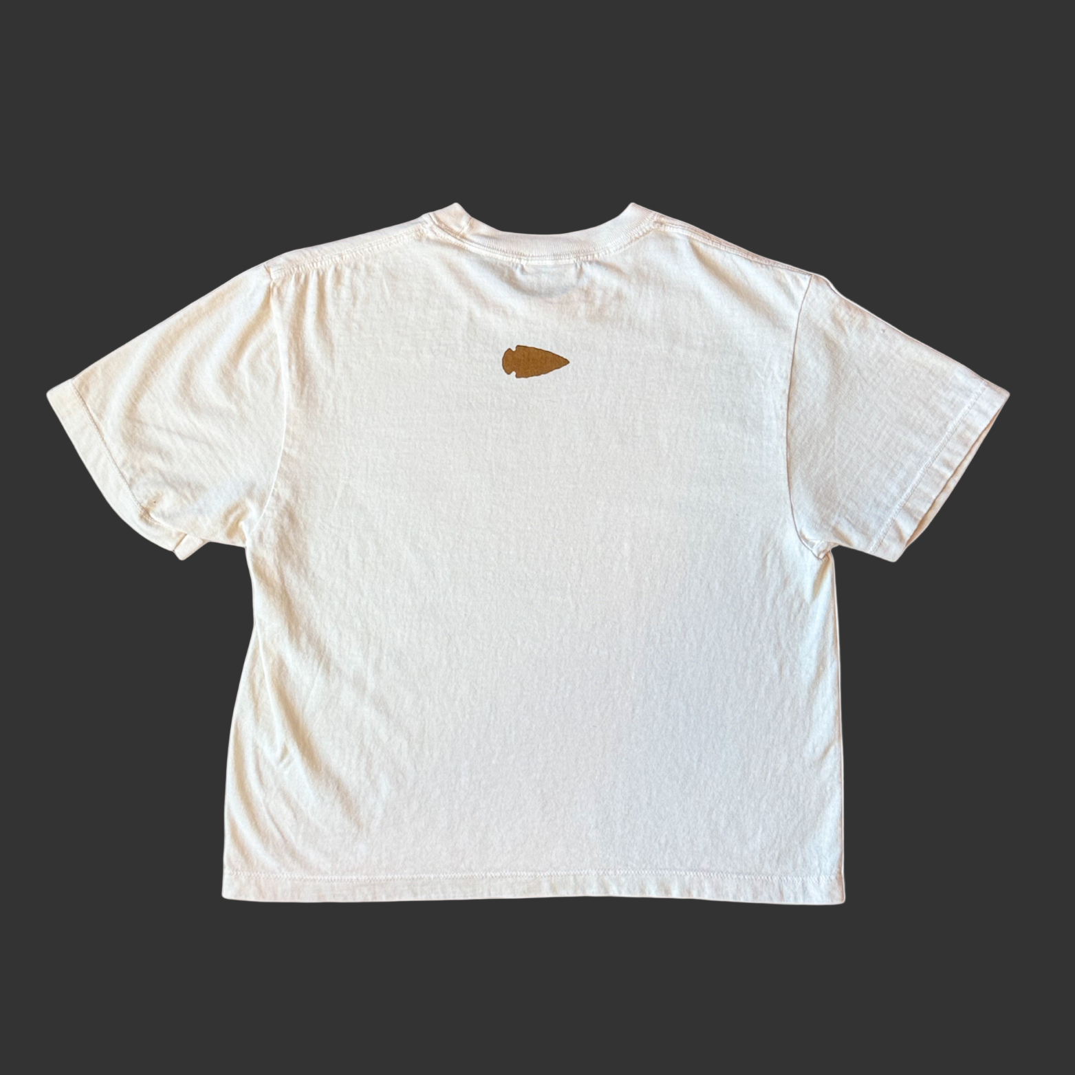 White t-shirt with a small brown logo on the chest against a white background